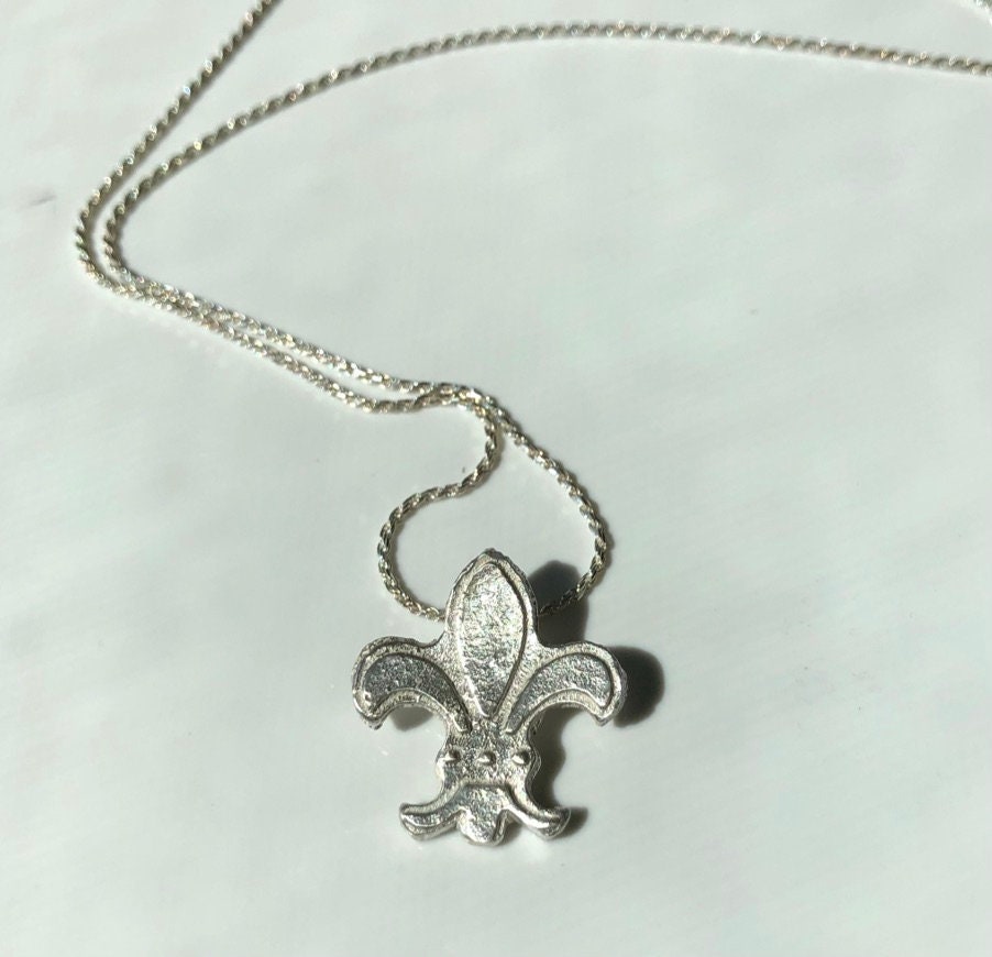 Fleur-de-lys medieval sand cast pendant in bright sterling silver with unique texture
