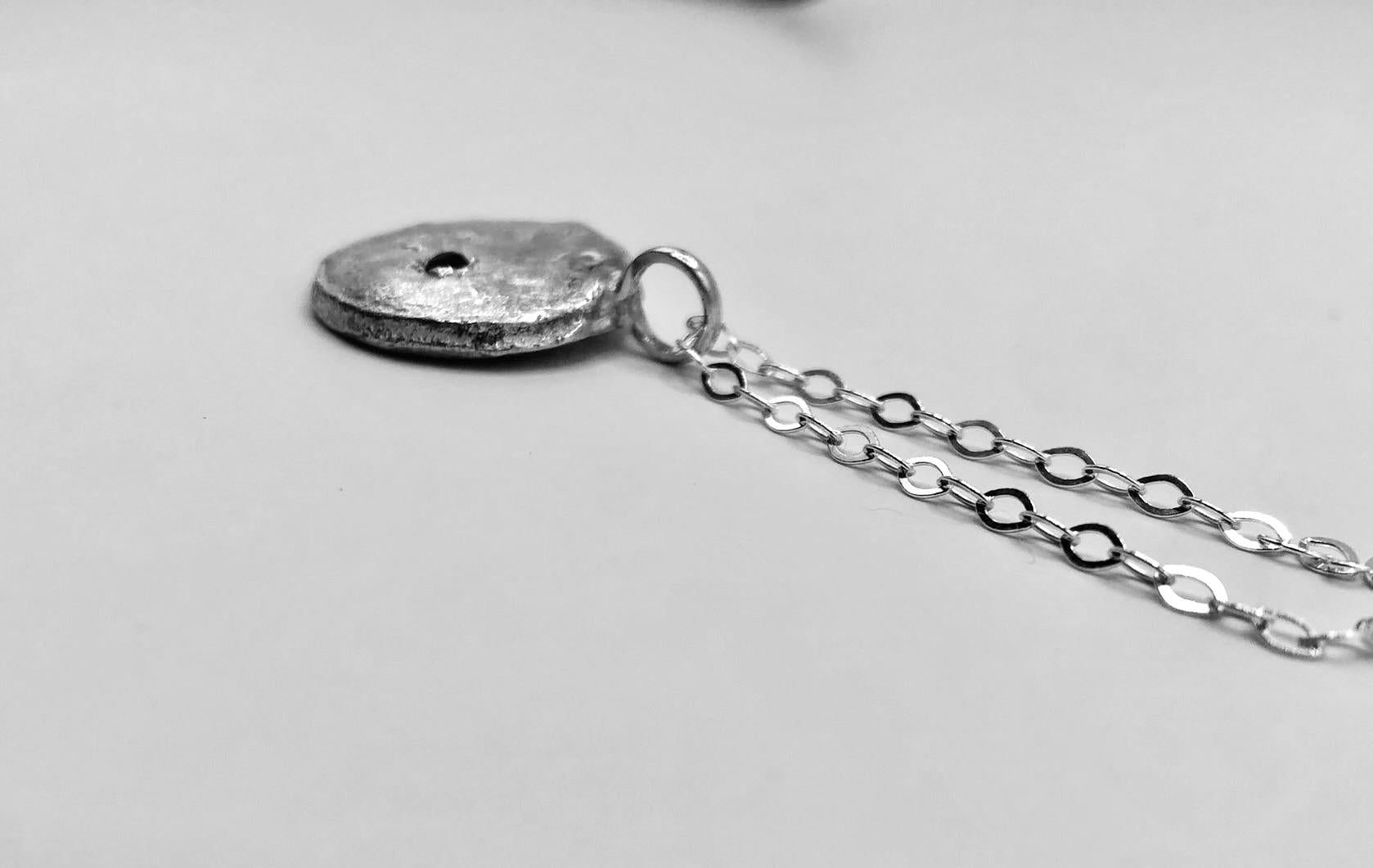 Silver Moon Disc with Ruby gem stone